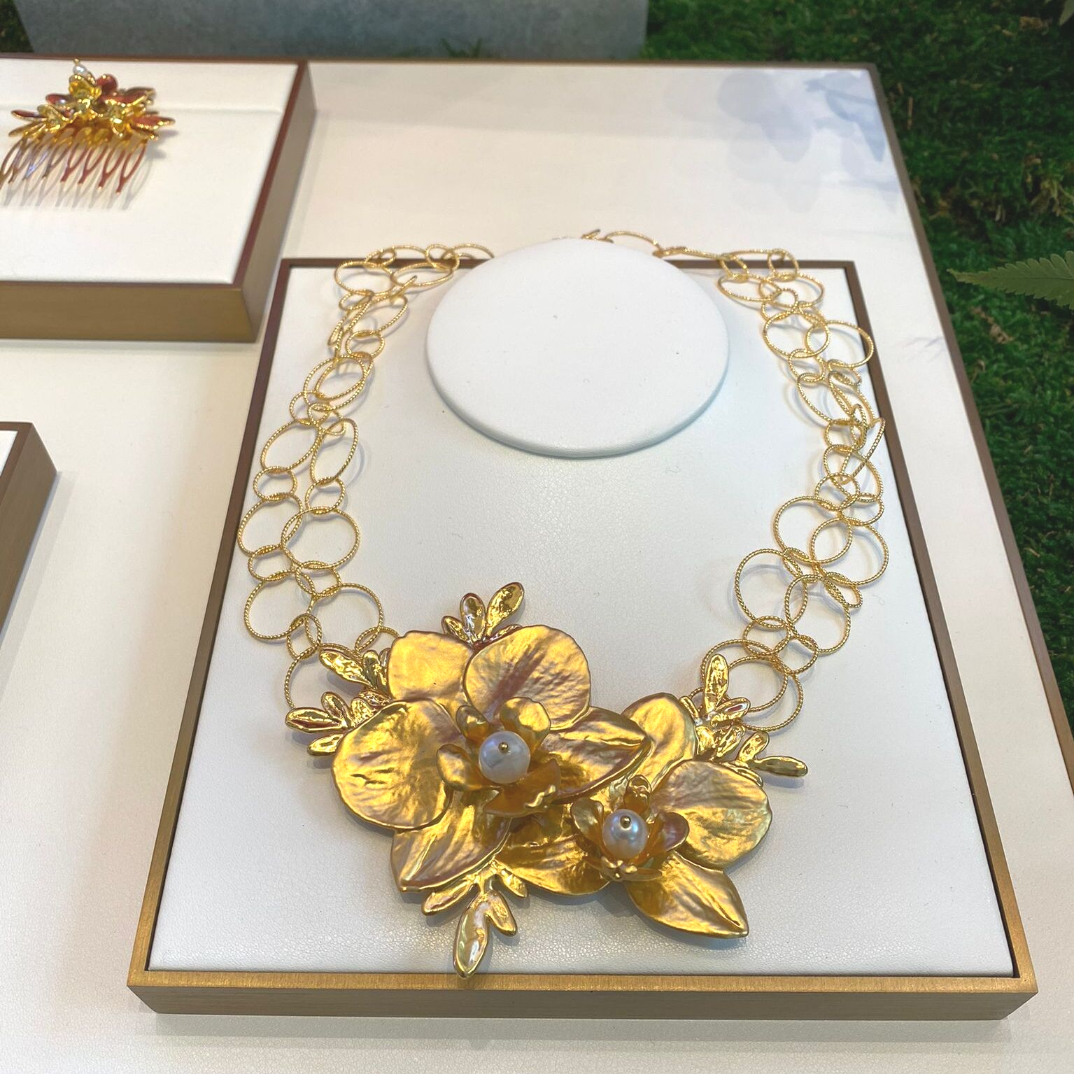 Natural Phalaenopsis Orchids and Ruta Graveolens encapsulated in 24K Swiss Gold with Baroque and Oval Freshwater Pearls