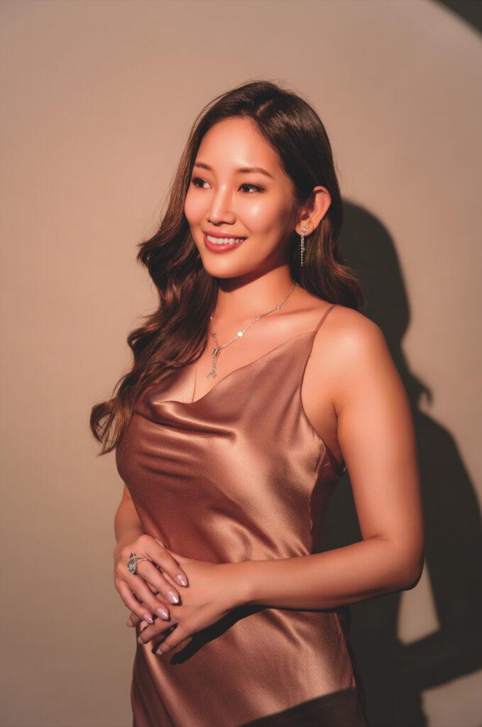 Joey wears a Bylgari B.Zero1 18K White Gold Station necklace and a rose gold Saint Laurent dress.
