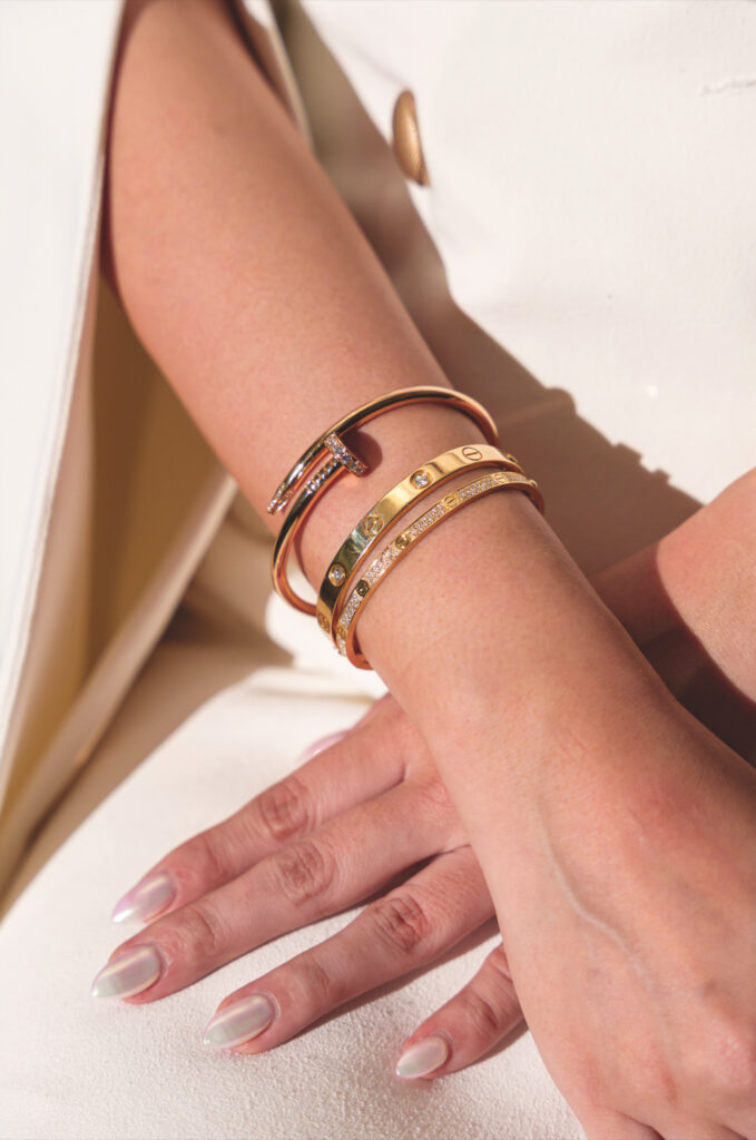 Joey wears the Cartier Love bracelet, her favourite piece of jewellery, here stacked with the Cartier Juste un Clou bracelet.